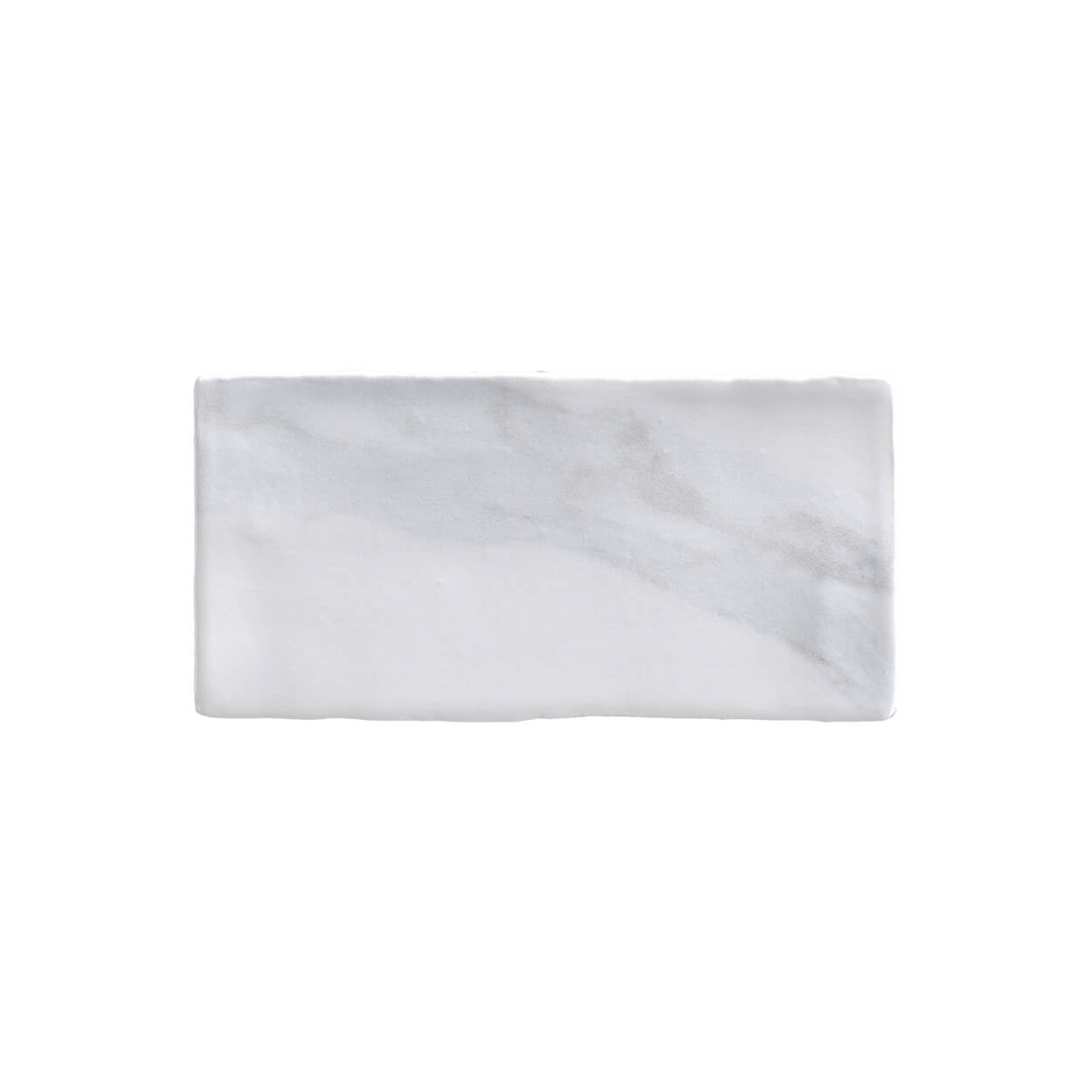 A white marble tile with a black border.