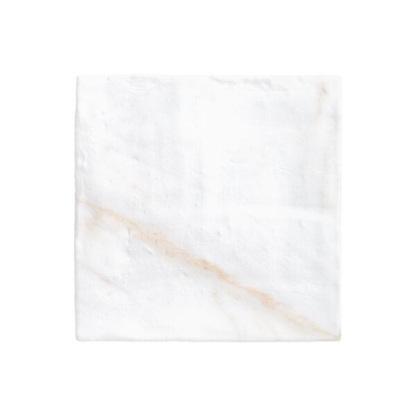 A white marble tile with some brown lines