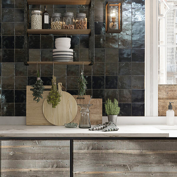 A kitchen with a counter and shelves in it