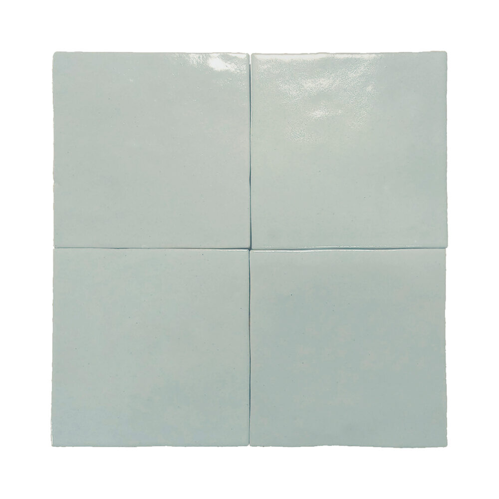 A square tile with four squares on it.