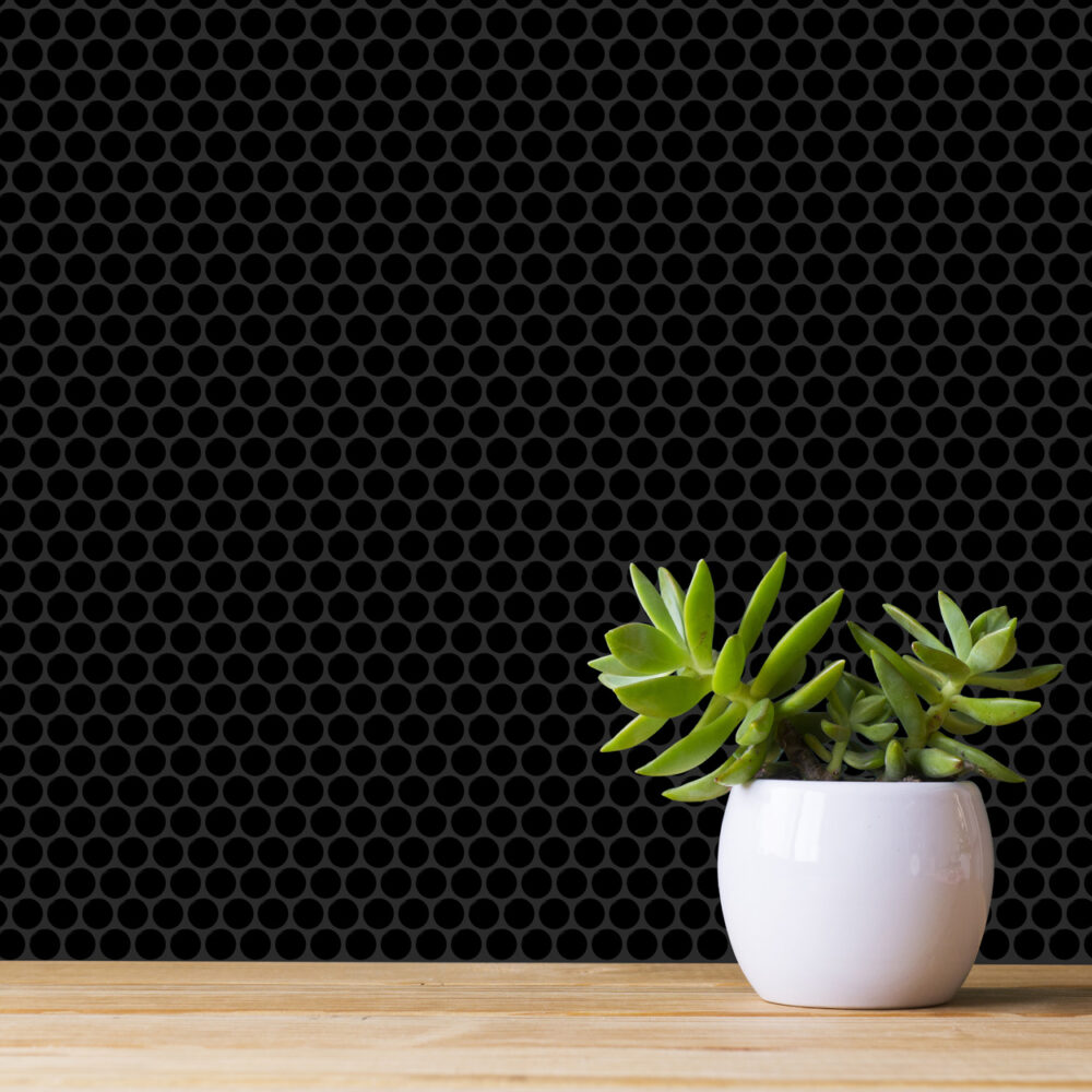 A white pot with some green plants in it