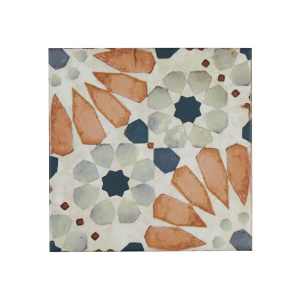 A tile with orange and blue flowers on it.