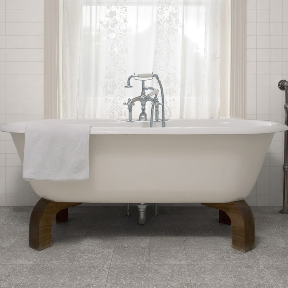 A white bathtub sitting in the middle of a bathroom.