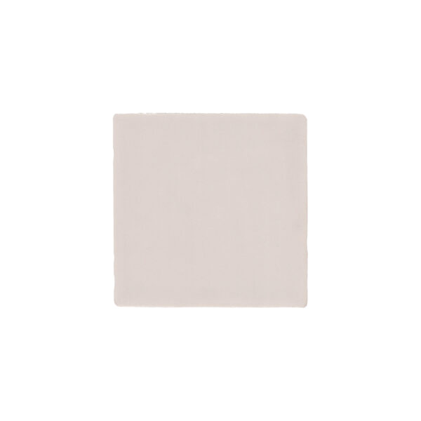 A square white tile sitting on top of a floor.