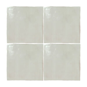 A set of four white tiles with a square design.