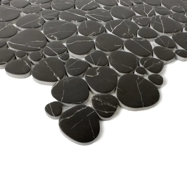 A black pebble tile floor with white grout.