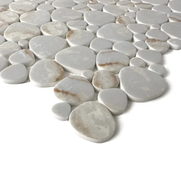 A white tile floor with brown and beige stones.