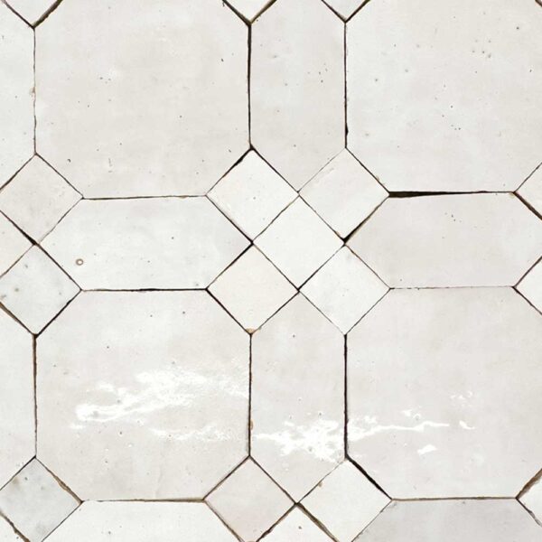 A white tile floor with many different shapes.