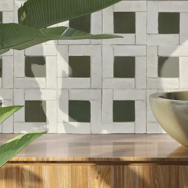 A bowl and plant on top of a table.