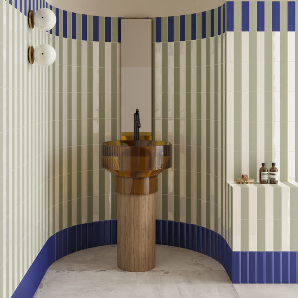 A bathroom with blue and white striped walls, a sink and a mirror.