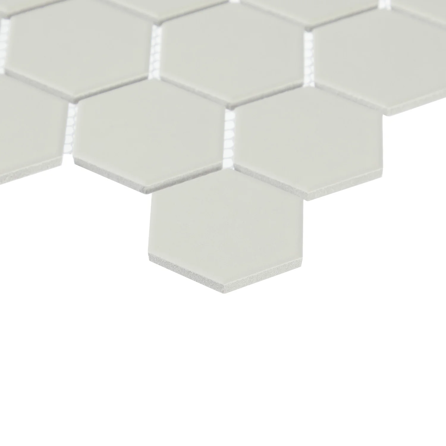 White hexagonal tiles arranged in a honeycomb pattern.